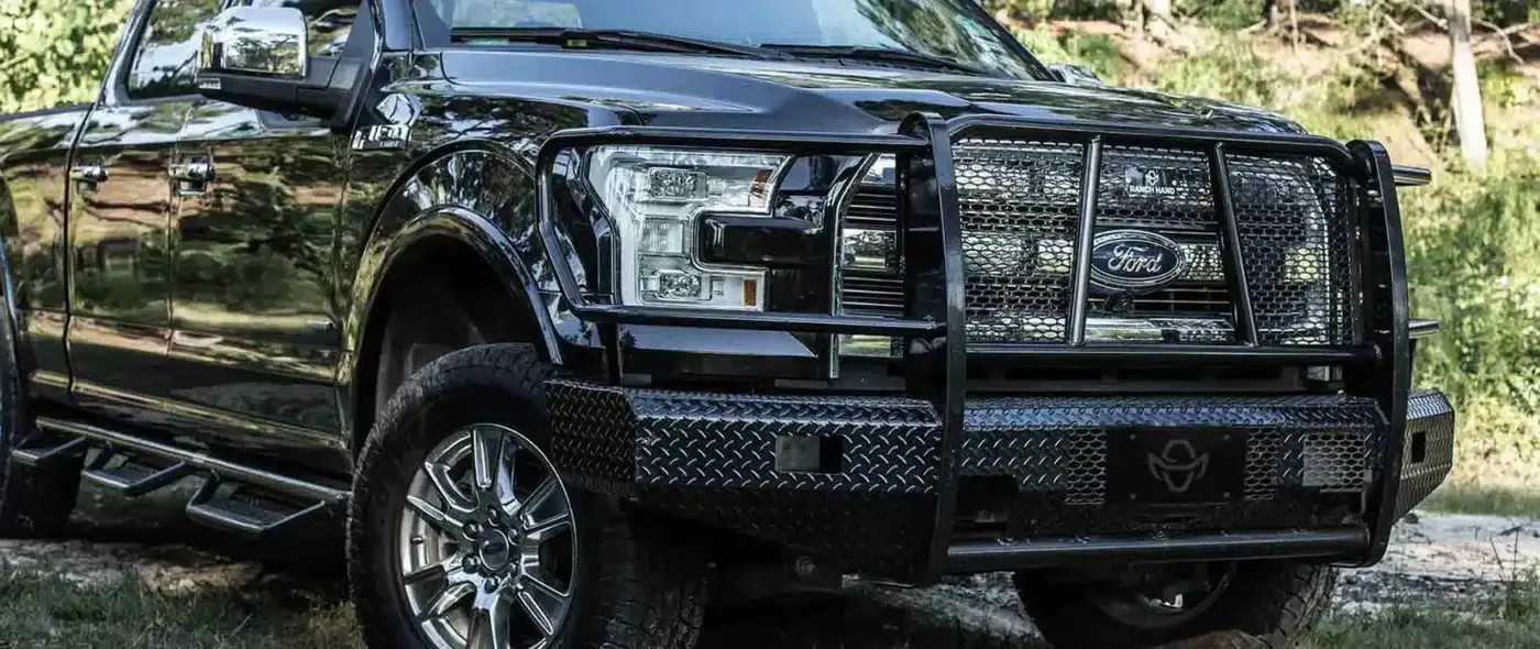 Black Ford pickup fitted with a heavy-duty Ranch Hand grille guard